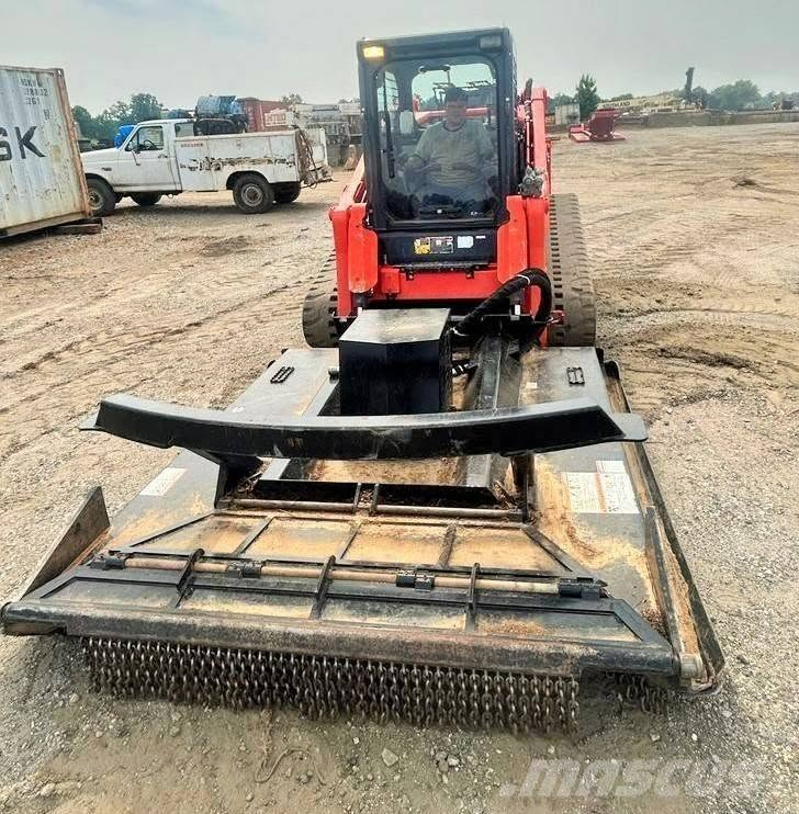 Track loader fitted with a heavy duty brush cutter attachment